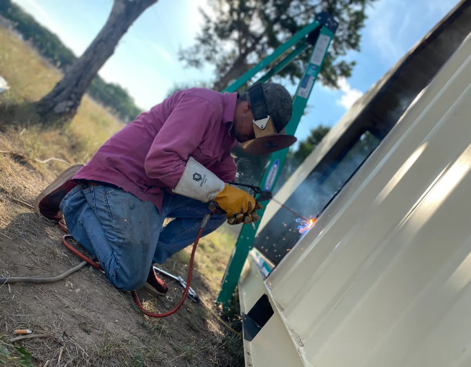 Mobile welding service with sparks for on-site welding repair near San Antonio Texas