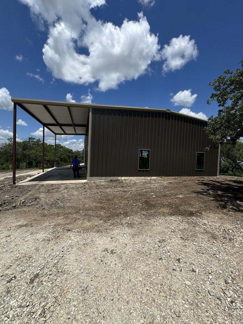 Brown steel building with covered awning, San Antonio area