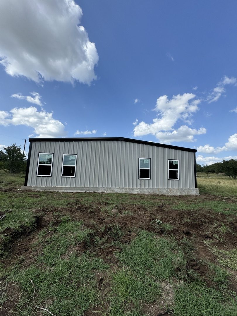 White metal building with windows, New Braunfels area